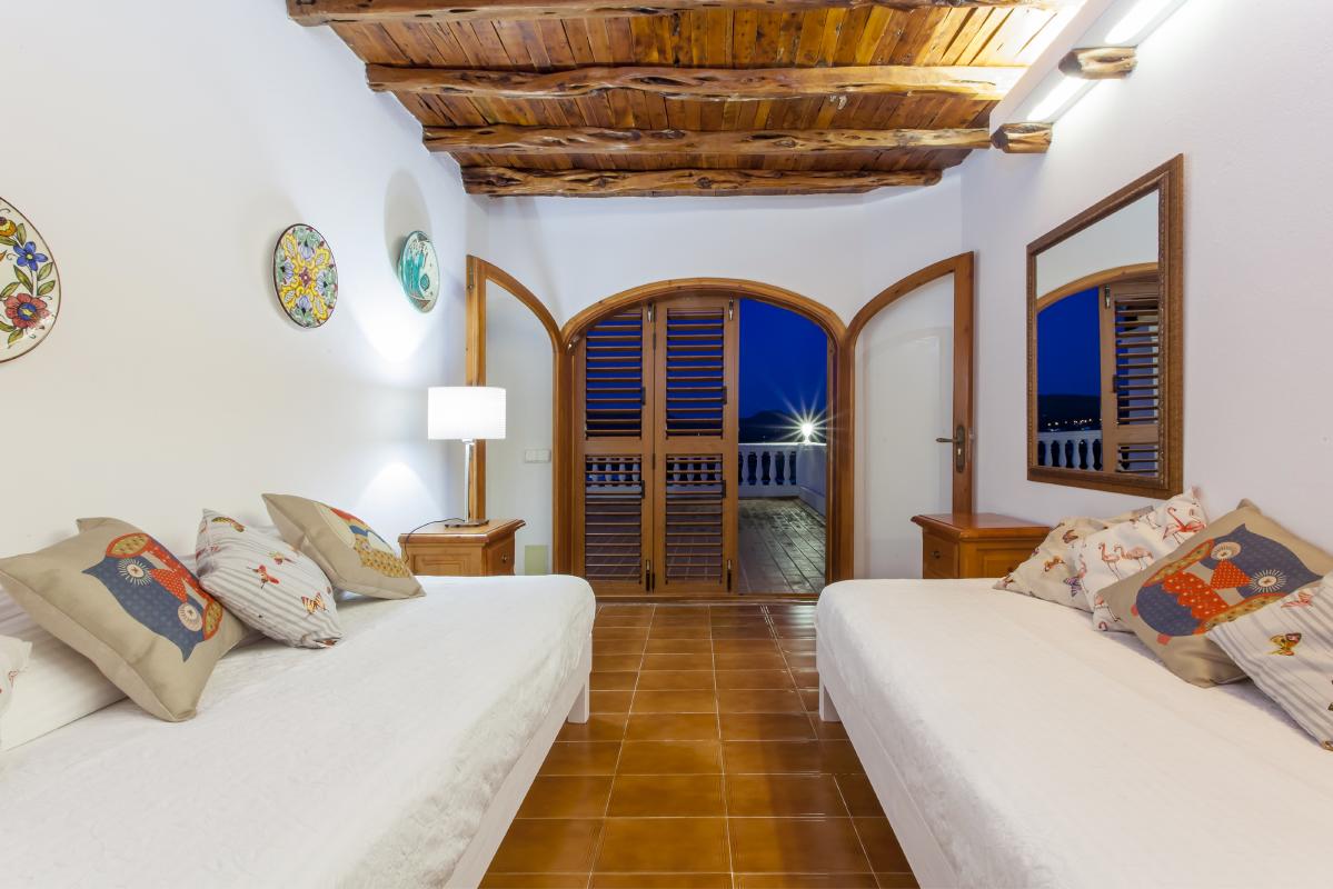 Beautiful very informal interior living room with wooden ceilings preserving the ibicenco style